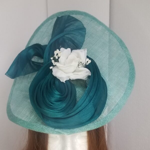 large aqua hat with silk abaca decoration close up