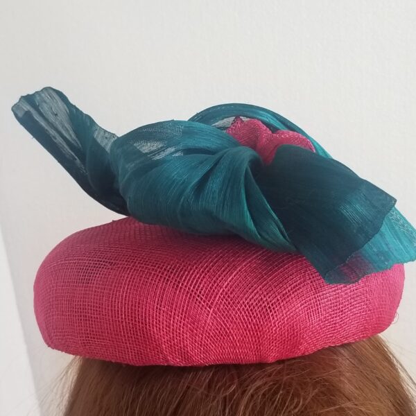 pink button hat with aqua trim reverse side