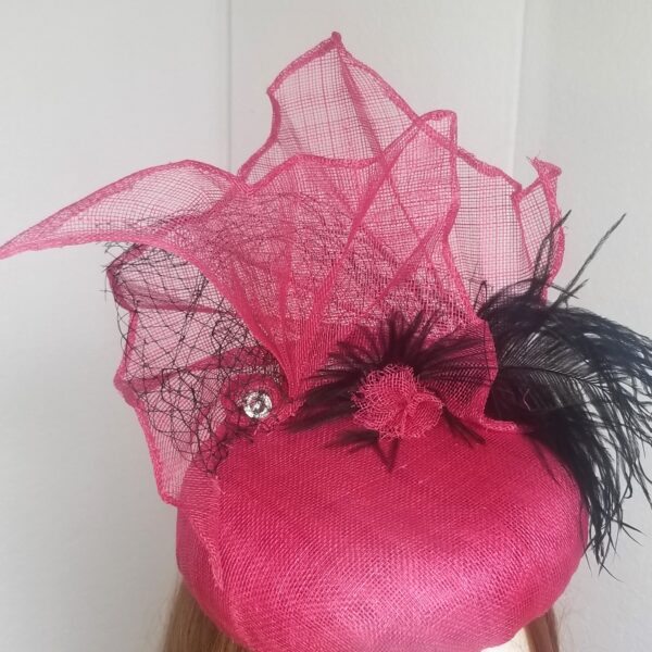 pink and black fan hat close up