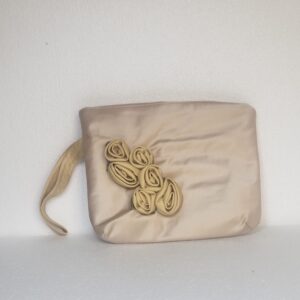 small beige clutch bag with roses and hand loop