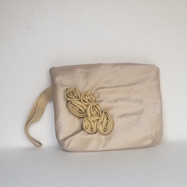 small beige clutch bag with roses and hand loop