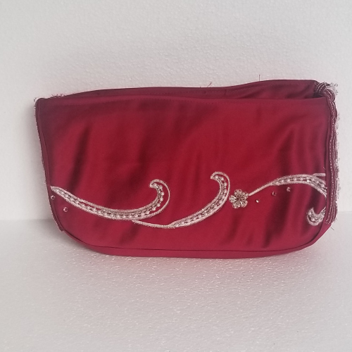 red zipped clutch bag