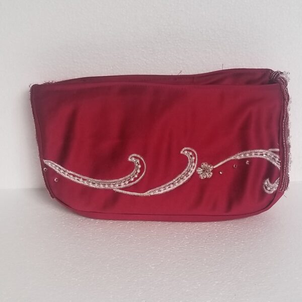 red zipped clutch bag