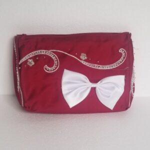 red clutch bag with white bow
