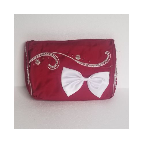 red clutch bag with white bow