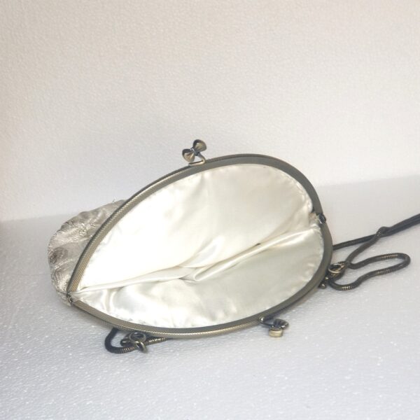 white and gold clutch inside