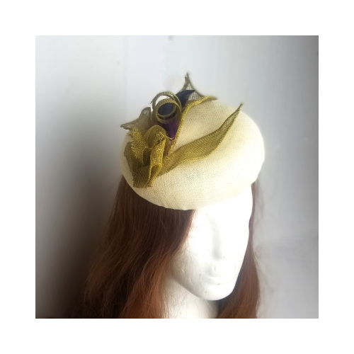 cream sinamay hat with gold sinamay and feather decoration