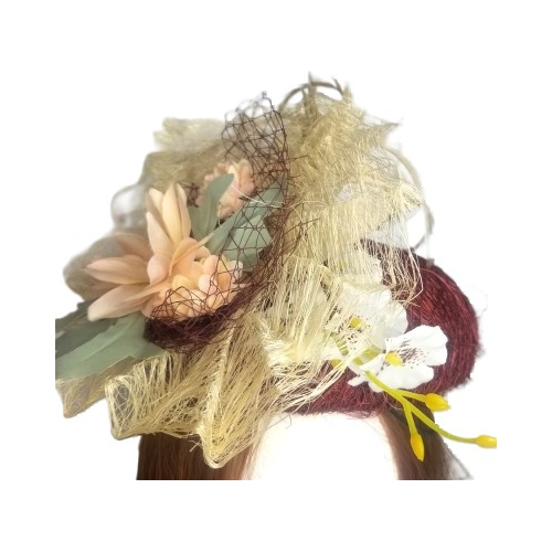 aubergine tangletuft flower and feather hat